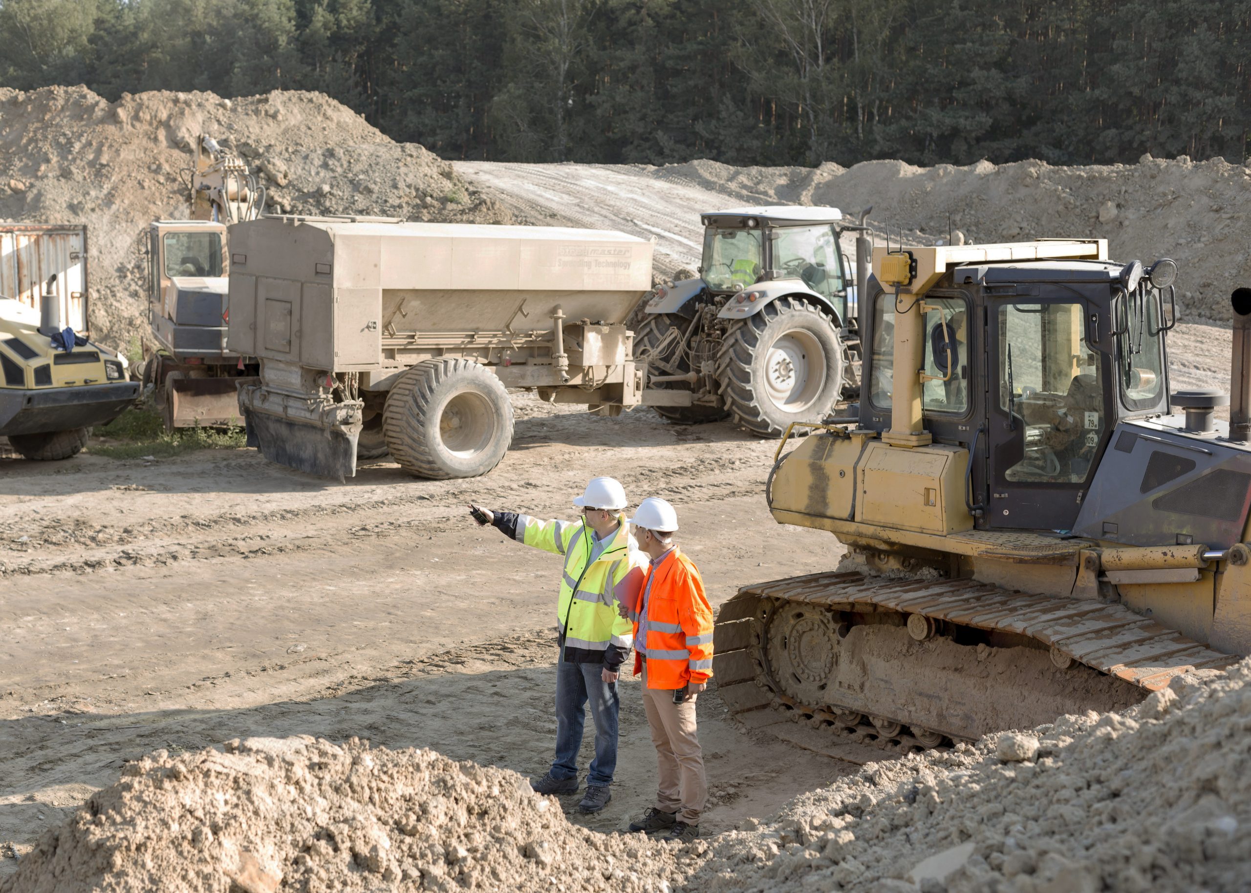 Two men at an excavation site. Link takes you to Business Loans page.